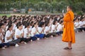 BANGKOK THAILAND - AUGUST 22,2017 : thai female student meditation and praying with buddhist monk in open park early morning