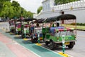 Bangkok, Thailand August 2: Thai TukTuk taxi parking in the row beside the grand palace on August 2, 2015 in Bangkok, Thailand. Royalty Free Stock Photo