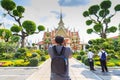 Tourists take pictures Giant statues in Wat Arun, Temple of Dawn