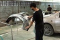 Checking car body work fiber bumper at car garage