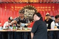 Woman wait for chef cooking a pizza and hamburger