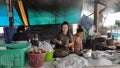 Bangkok, Thailand, August 22, 2020 - Women cooks preparing meals in Isann restaurant kitchen