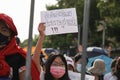 Young protesters show text mean `Down with feudalism, long live the people.`