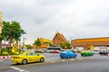 BANGKOK, THAILAND - 2.11.2019: City traffic before the Wat Pho temple in Bangkok. Cars, taxi and tuk tuks are riding on the street Royalty Free Stock Photo