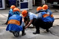 Bangkok, Thailand: Construction Workers with Orange Helmets