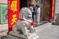 Lion statue and Unacquainted Thai people come to Wat Mangkon Kamalawat Bangkok city Thailand.