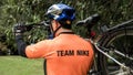 BANGKOK, THAILAND - December 03 2017: back male cyclist carry mountain bike and wearing a Nike team shirt