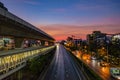 Beautiful Sunset sky with Traffic near BTS in the bangkok City Royalty Free Stock Photo