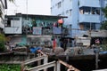 Beggarly dilapidated shack in the Asian metropolis. Modern Asian slums