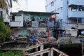 Beggarly dilapidated shack in the Asian metropolis. Modern Asian slums Royalty Free Stock Photo