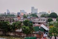 Beggarly shacks of the Asian metropolis. Slums of the capital of Thailand. City landscape