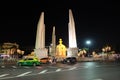 Democracy Monument located at the intersection of the streets of the night city. Street