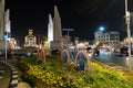 Democracy Monument located at the intersection of the streets of the night city. Street