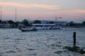 A large pleasure boat floats on the Chao Phraya river in the late evening Royalty Free Stock Photo