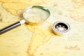 Bangkok, Thailand - December 15, 2021 Magnifying glass on ancient vintage world map