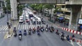 Many cars parked on stree at red traffic light, with motorcycles parked in front of them in center Bangkok, Thailand. Royalty Free Stock Photo