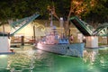 Model of a warship among the artificial pond at night