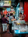 BANGKOK, THAILAND -  December 2019: People are buying food at night street food market Royalty Free Stock Photo