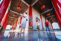 Bangkok, Thailand - December, 20, 2021 :People walking on constricted of beside main building with Stone carving on the wall and