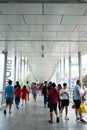 BANGKOK, THAILAND - DECEMBER 25, 2019: People walking on a overpass in front of Central World mall