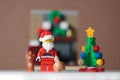 Bangkok, Thailand- December 14,2016: Santa Claus Lego minifigure holding bag with cat and christmas tree. Studio Shot