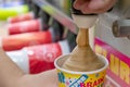 BANGKOK, THAILAND - DECEMBER 18: Slurpee machine fills up a paper cup with Coca-Cola flavored Slurpee in 7-Eleven on Petchkasem 69 Royalty Free Stock Photo