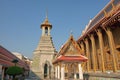 Small religious buildings in the territory of the Temple of the Emerald Buddha on a sunny