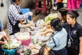 Street hawker cooking for papaya salad food for sale on the street. Green papaya salad is a spicy salad made from shredded unripe