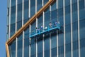 Window cleaners rappeling down the Spring Tower in Bangkok, Thailand Royalty Free Stock Photo