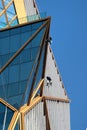 Window cleaners rappeling down the Spring Tower in Bangkok, Thailand Royalty Free Stock Photo