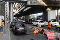 Workers cleaning sewer near Ratchathewi BTS skytrain station.