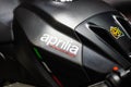 Bangkok, Thailand - Decemeber 5, 2019 : Aprilia racing logo on the body of black sports motorbike at a car show. Aprilia is an