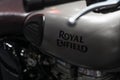 Bangkok, Thailand - Decemeber 5, 2019 : Royal Enfield logo on the Fuel tank of sports motorbike at a car show. Royal Enfield