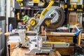 BANGKOK, THAILAND - 26.10.2021:  DEWALT sliding compound miter saw on wooden teble at carpenter workplace ,Bangkok Royalty Free Stock Photo