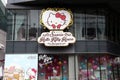 Logo sign beside the shop of Sanrio Hello Kitty coffee and bakery shop at Siam square shopping center. Royalty Free Stock Photo