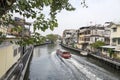 River taxi travels along the Bangkok canal to ferry passengers