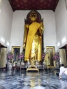 Standing golden Buddha statue in Wat Pho, Bangkok