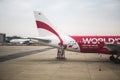 Bangkok, Thailand- Feb 20,2014: a tail of airasia airplane parking on ground link with a staircase waiting for passager come