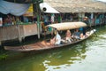 Bangkok, Thailand - Feb 11, 2018: Tourists enjoy traveling by tourist row boat on Lad Mayom canal.