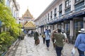 Tourists walk toward Grand Palace entrance in Bangkok