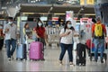 Air Travelers Wear Masks as a Precaution against Covid-19 Caused by Coronavirus