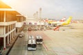 Airline bus for passenger and air plane of Scoot, Air Asia X parked with Jet bridge