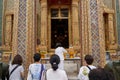 Bangkok, Thailand, february, 16, 2022: crowd praying at a temple during a Buddhist festival