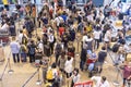 Crowd passengers with luggage in queue at check-in counter at airport, Thailand