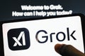 Grok logo chatbot on device screen