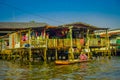 BANGKOK, THAILAND, FEBRUARY 08, 2018: Outdoor view of unidentified man in a boat, floating market in Thailand Royalty Free Stock Photo