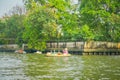 BANGKOK, THAILAND, FEBRUARY 08, 2018: Outdoor view of unidentified woman in a boat, floating market in Thailand Royalty Free Stock Photo