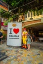 BANGKOK, THAILAND, FEBRUARY 02, 2018: Outdoor view of unidentified woman close to a macdonald toy real size close to an