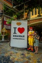 BANGKOK, THAILAND, FEBRUARY 02, 2018: Outdoor view of unidentified woman close to a macdonald toy real size close to an