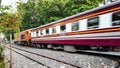 BANGKOK, THAILAND - FEBRUARY 15, 2018: The traditional Thai trains are sailing past the city center in the afternoon